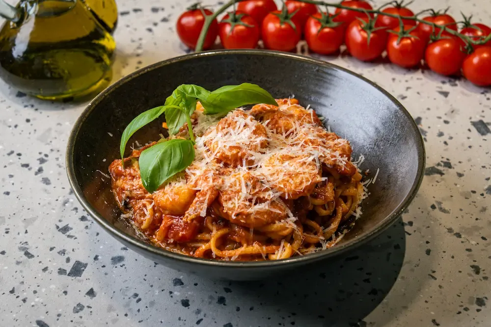 Shrimp linguini finished with tomatoes and fresh herbs